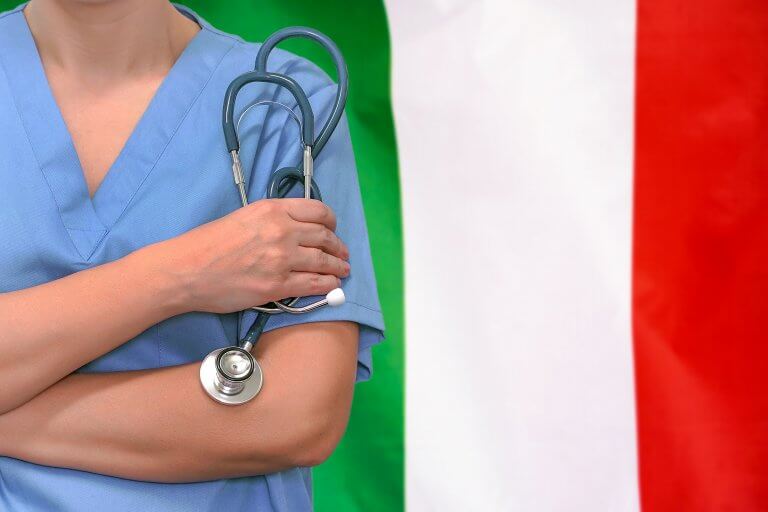 Surgeon or doctor with stethoscope in hand on the background of the Italy flag