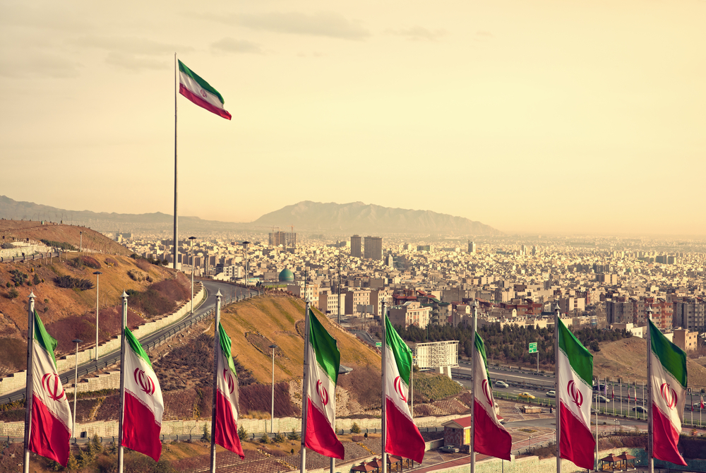 Iranian flags in front of Tehran