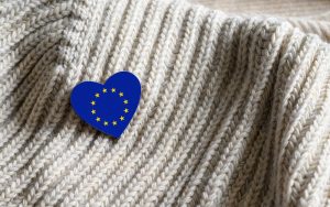 Flag of the European Union in the shape of a heart on warm woolen things