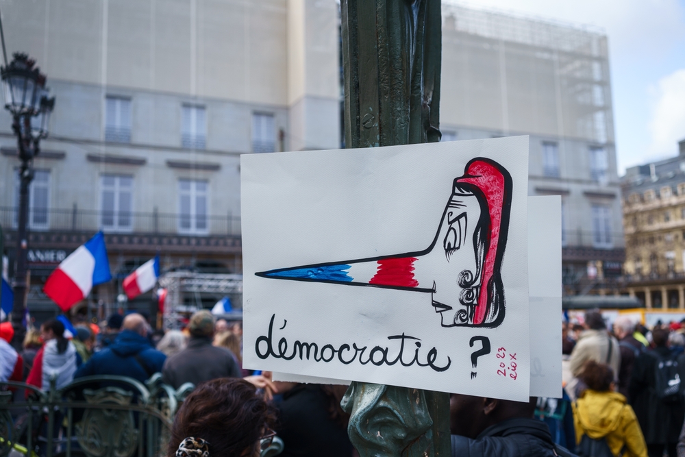 Sign saying "democracy?" in French in a Protest against the pension reform