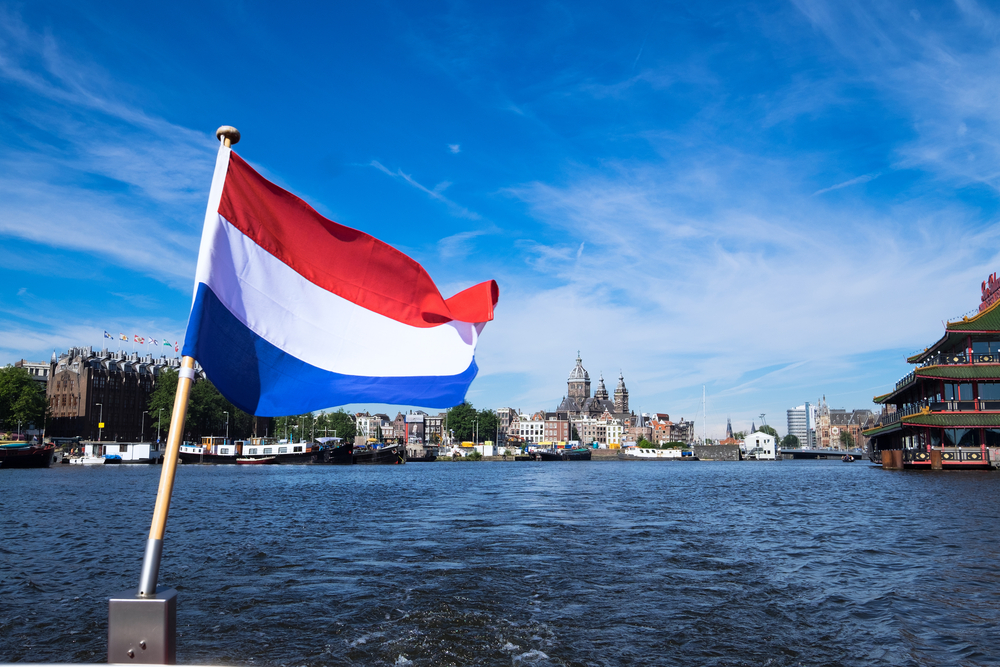 the Netherlands flag and the river in Amsterdam