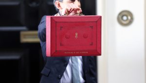 Rishi Sunak holds the red dispatch box outside 11 Downing Street