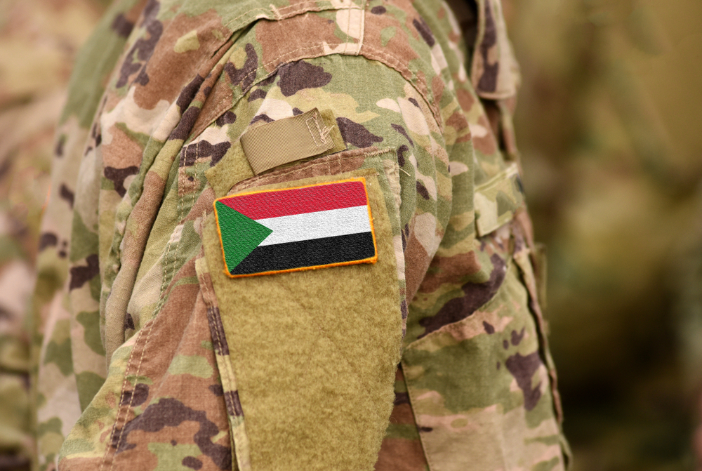 flag of Sudan on the soldiers arm