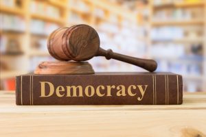 Democracy Law, Books, And A Judge Gavel On Desk