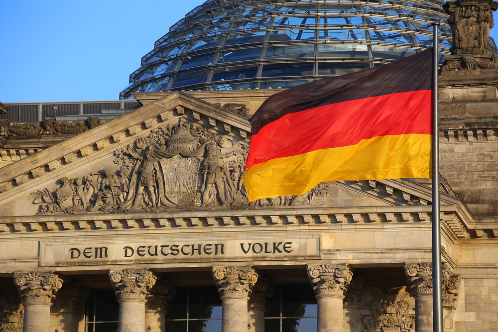 The,German,Flag,In,Front,Of,The,Reichstag,Building