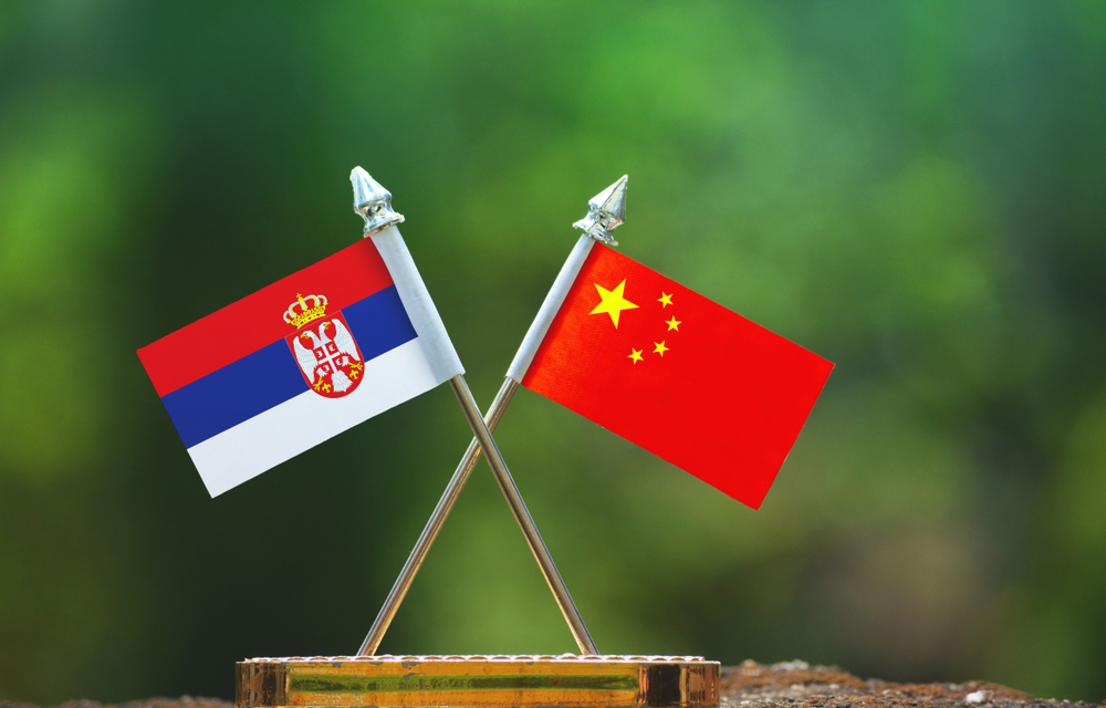 China,And,Serbia,Small,Flag,With,Blur,Green,Background