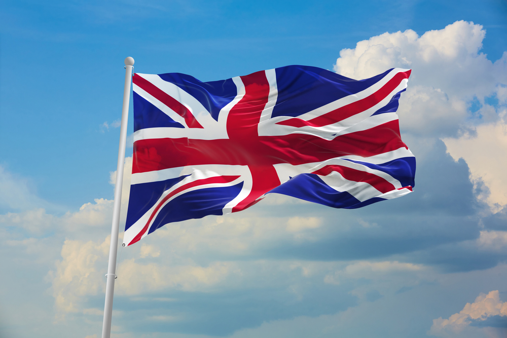 Flag,Of,Great,Britan,Being,Waved,In,The,Breeze,Against