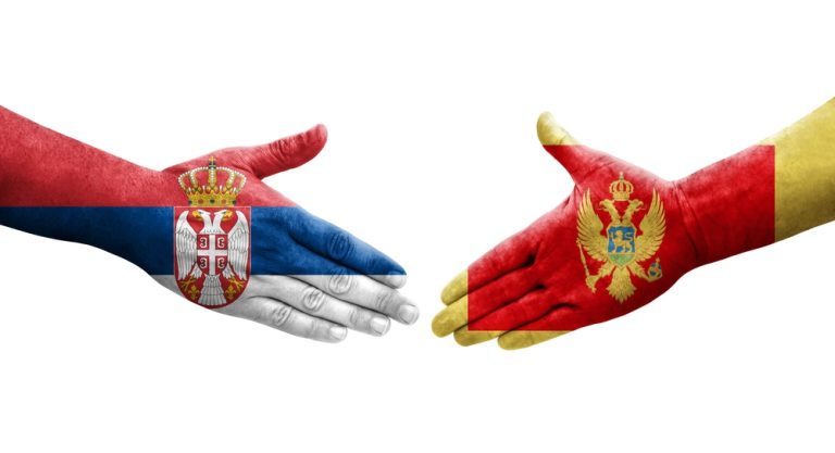 Handshake,Between,Montenegro,And,Serbia,Flags,Painted,On,Hands,,Isolated